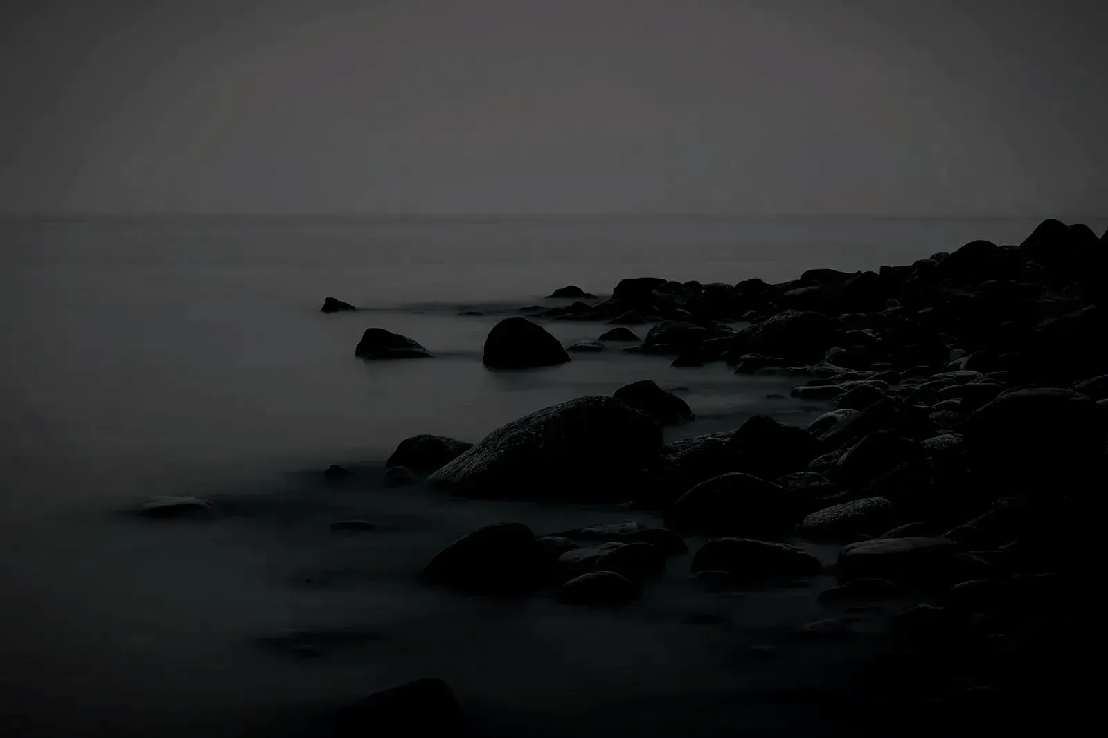 A moody northern coastline under grey cloud